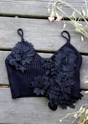The Finnish National Romance Museum creates ready to wear pieces inspired by Finnish nature, history and culture. The FNRM knitted lace top with unique details. 