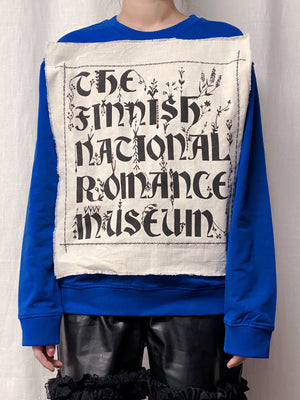 The Finnish National Romance Museum creates ready to wear pieces inspired by Finnish nature, history and culture. The FNRM Museo Collage shirt, blue.